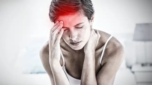 Woman suffering from migraine